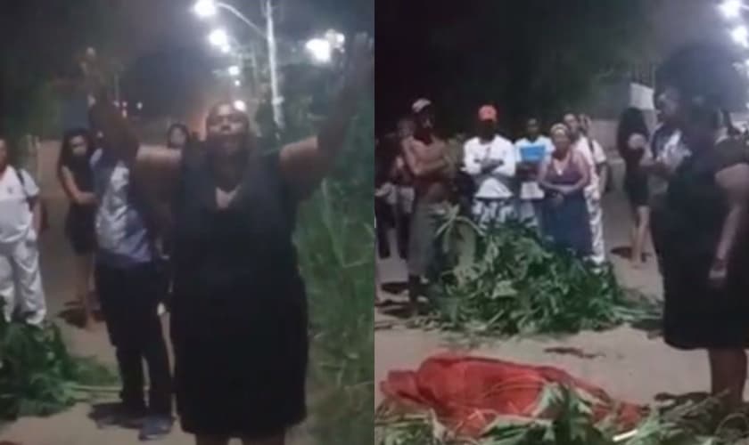 A mãe com o corpo do filho em rua no RJ. (Foto: Reprodução/Portal Tucumã)